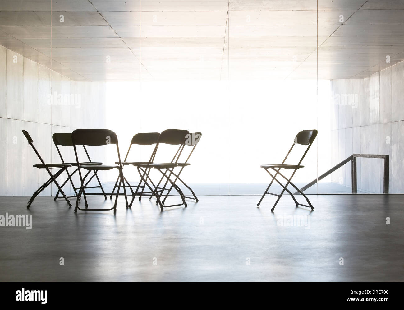 Empty office chairs arranged in circle Stock Photo