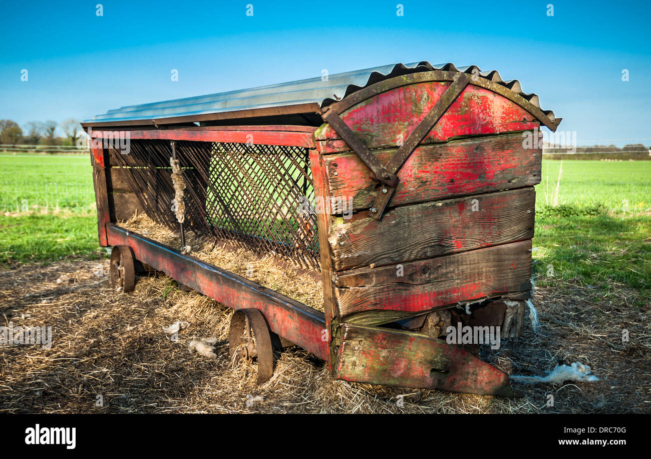 Rustic old wooden hay feeder for cattle in a field Stock Photo Alamy
