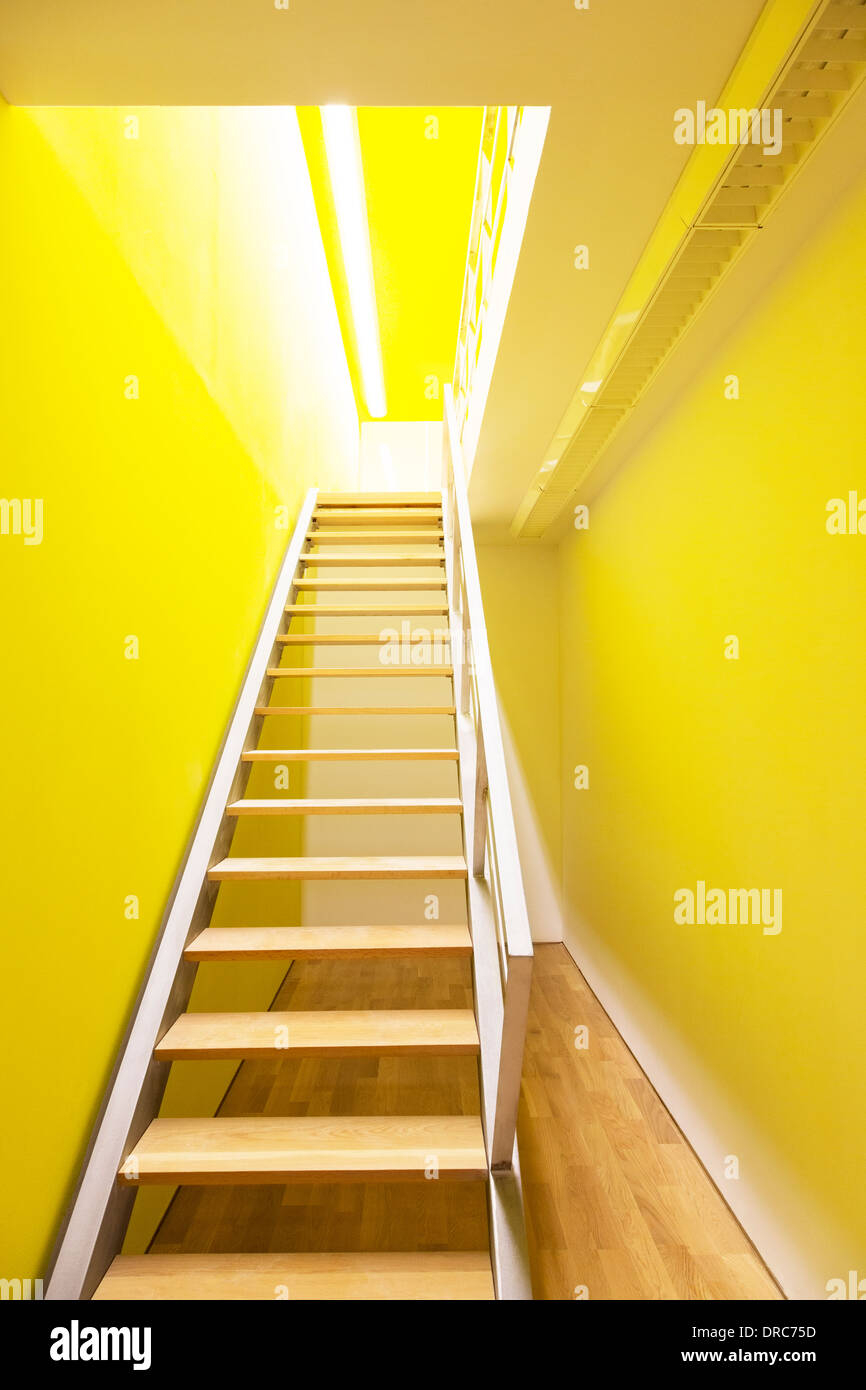Stairway leading to bright room Stock Photo