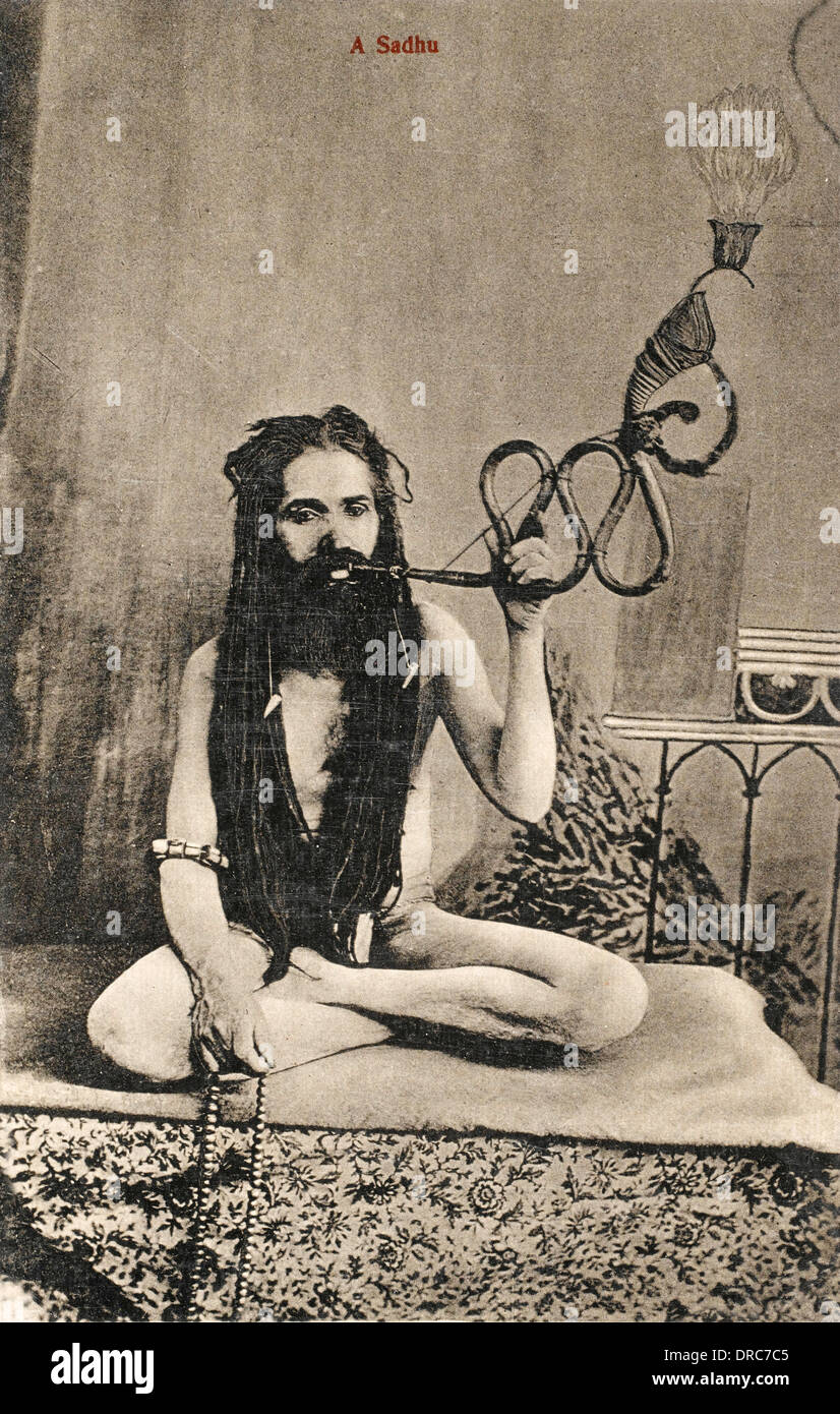 A Sadhu smoking a remarkable pipe, India Stock Photo Alamy