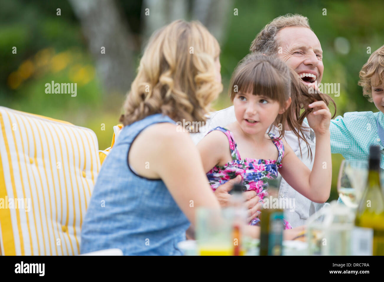 Family eating on patio Stock Photo