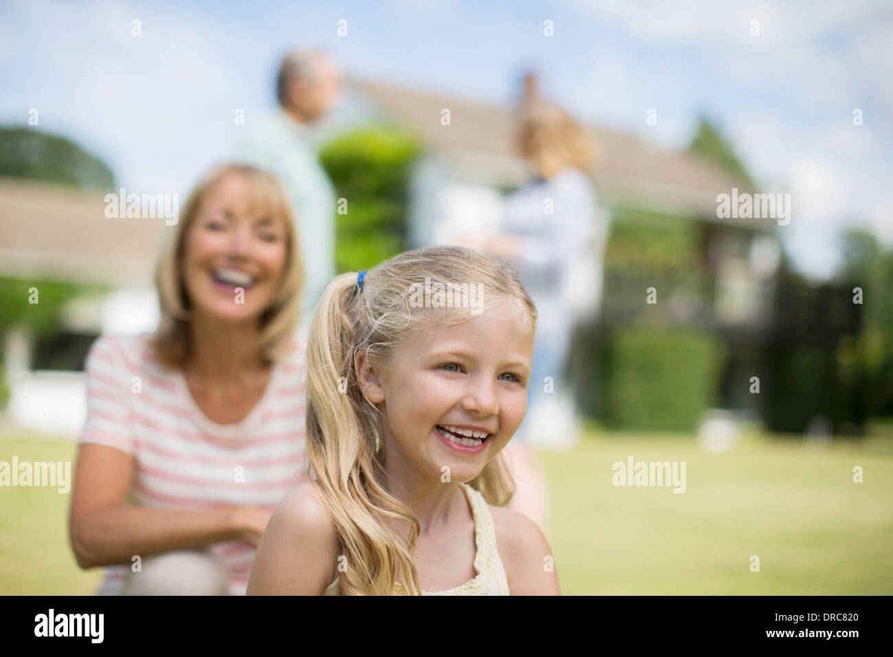 Grandmother and granddaughter smiling outdoors Stock Photo