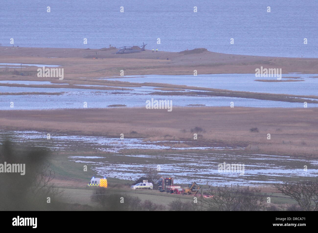 Cley-next-the-Sea Norfolk Pave Hawk crashed 8pm 7th December 2014 on shingle bank. Crew of four dead. © John Worrall Alamy Live News. Recovery vehicles heading to crash site. Stock Photo
