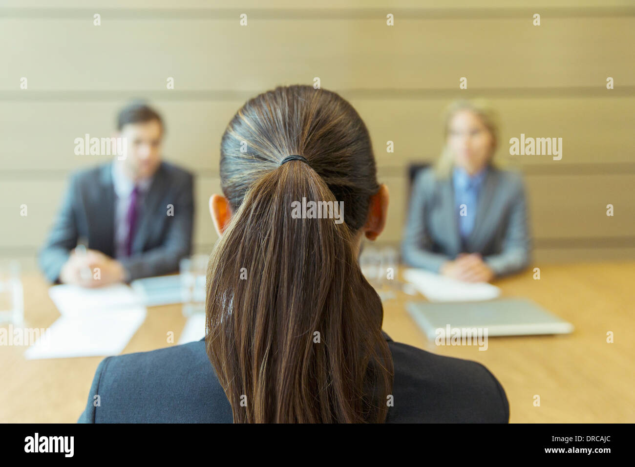 Businesswoman sitting in meeting Stock Photo