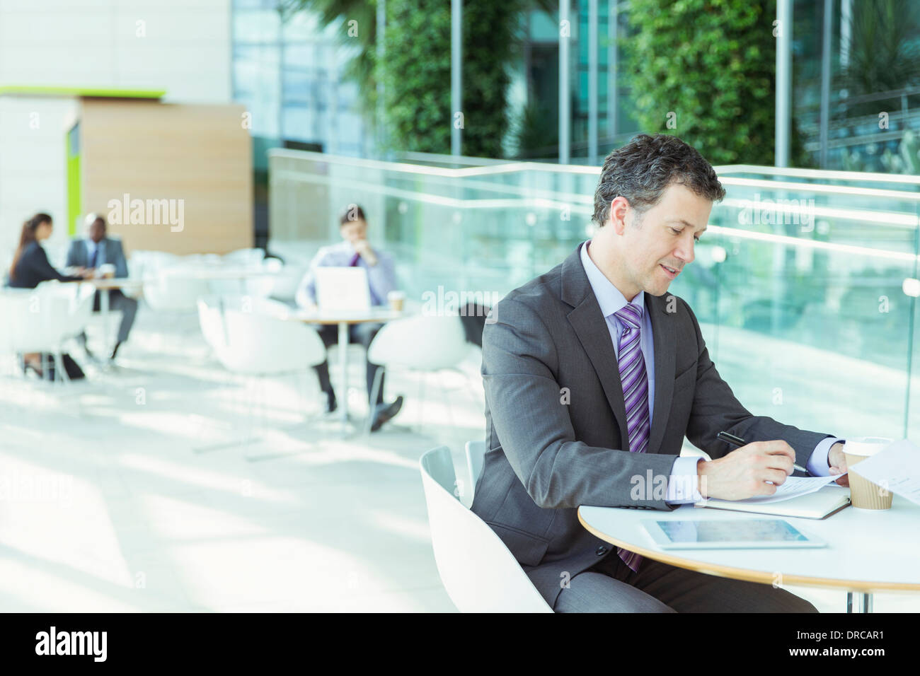 Businessman working in cafe Stock Photo