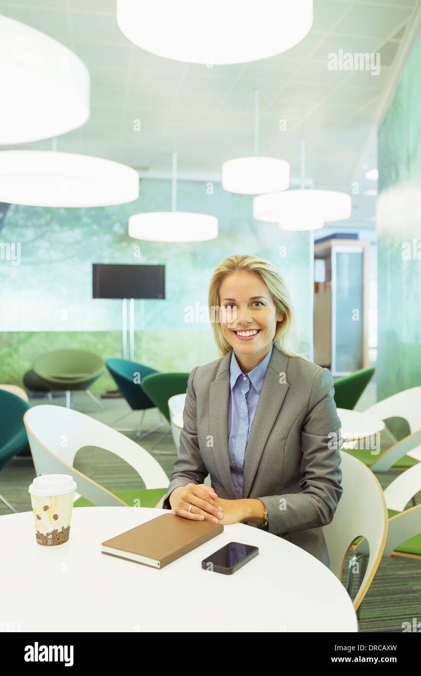 Businesswoman sitting in office Stock Photo