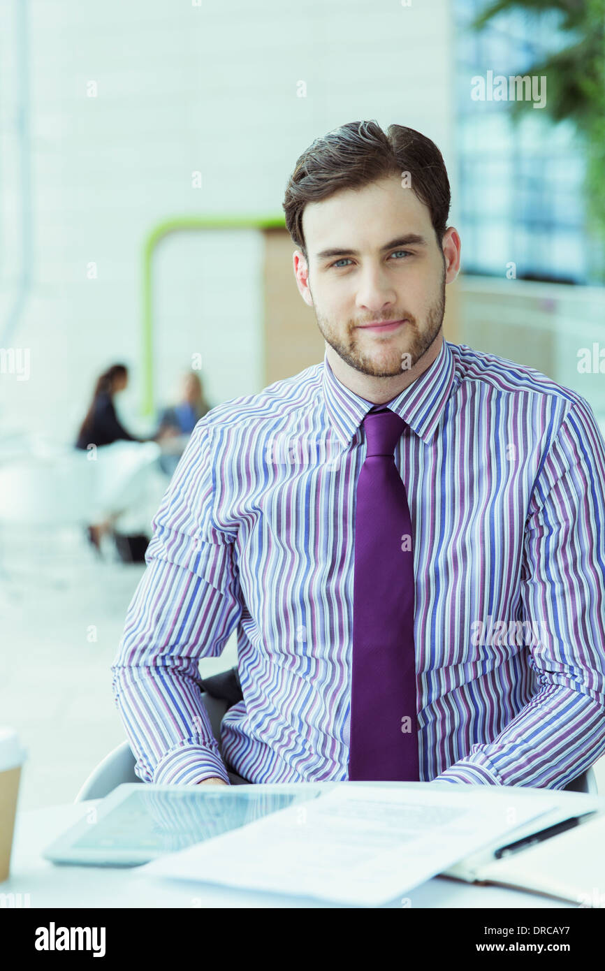 Businessman sitting in office Stock Photo