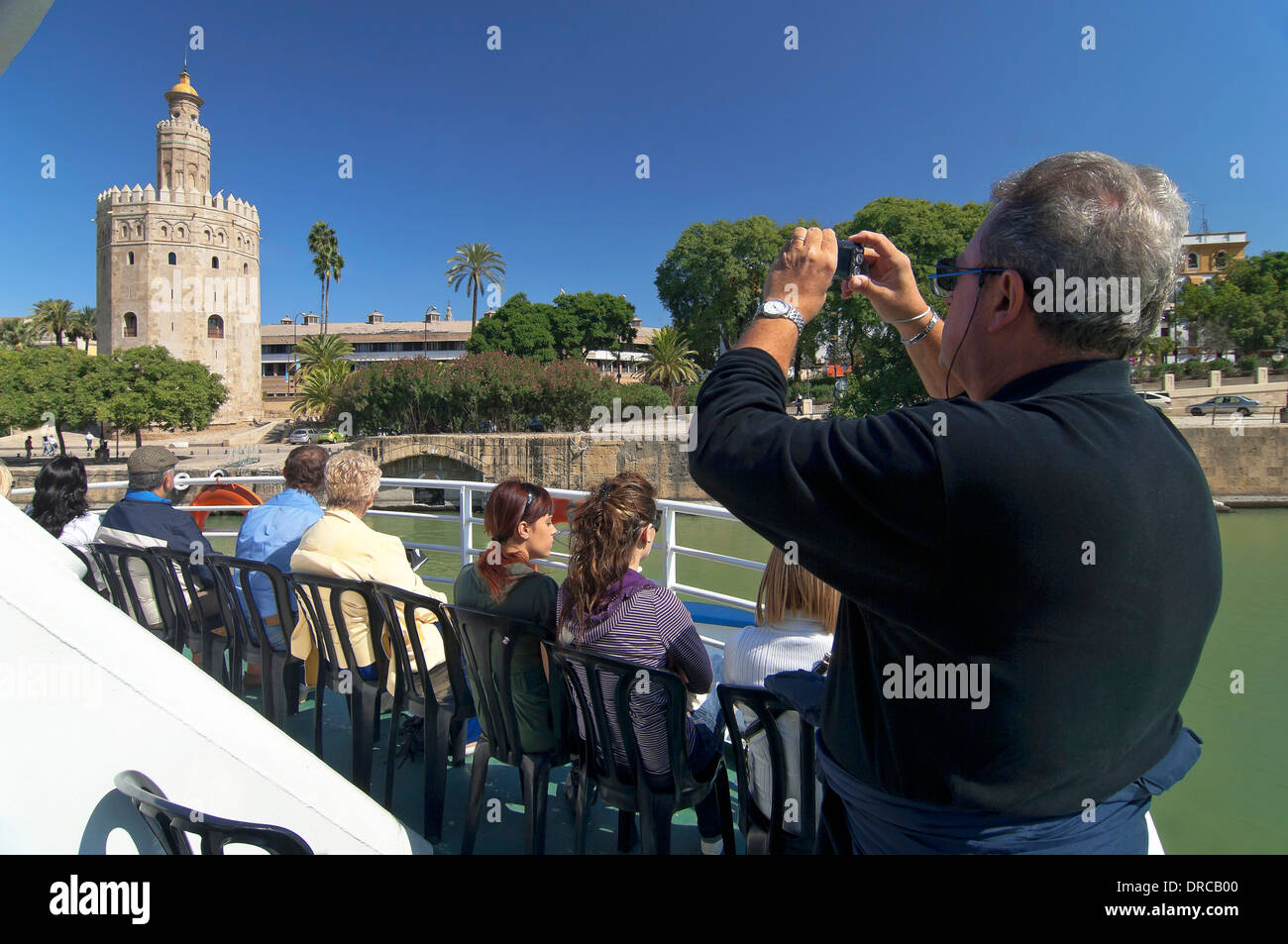 Sightseeing on the river Guadalquivir and Torre del Oro, Seville, Region of Andalusia, Spain, Europe Stock Photo