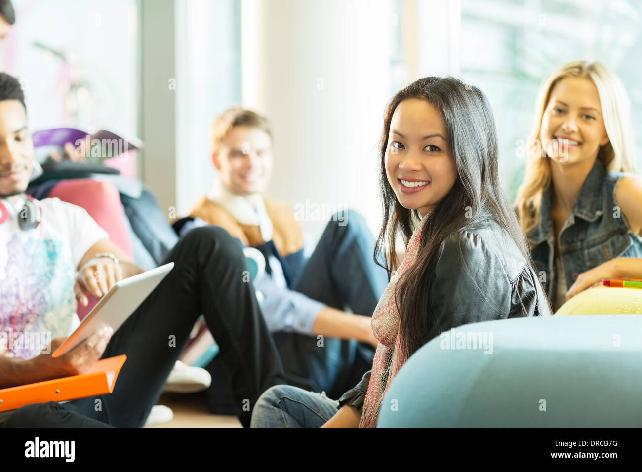 University students smiling in lounge Stock Photo