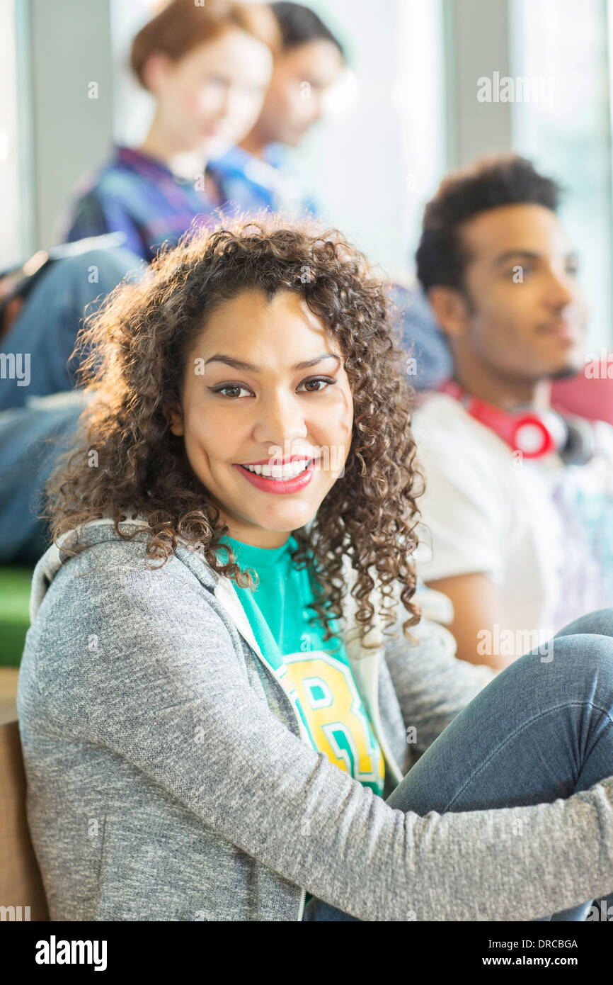 University student smiling in lounge Stock Photo