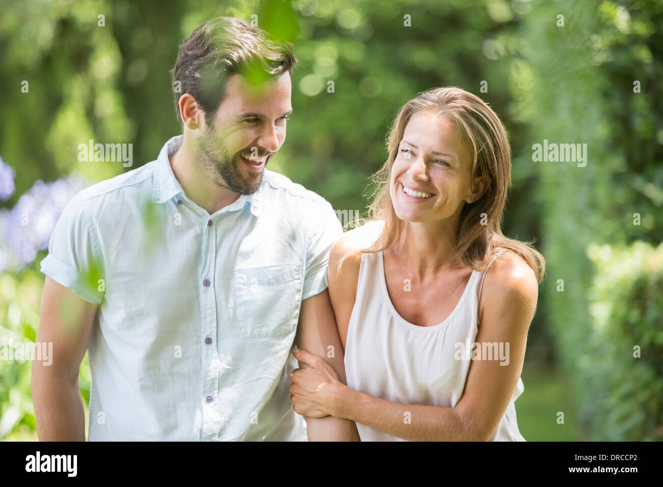 Couple walking together outdoors Stock Photo