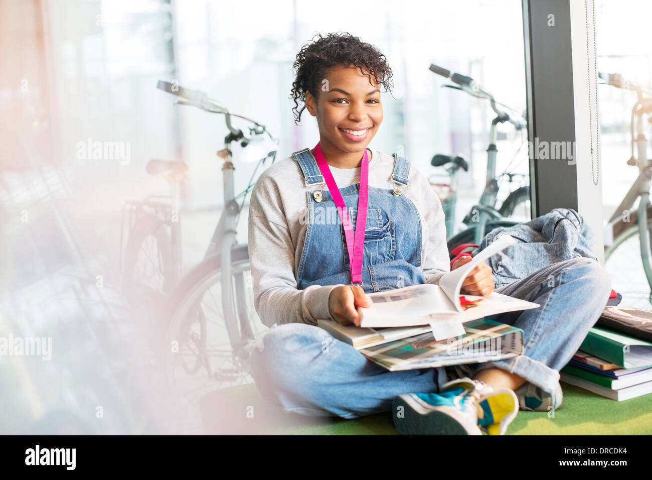 University student reading in lounge Stock Photo
