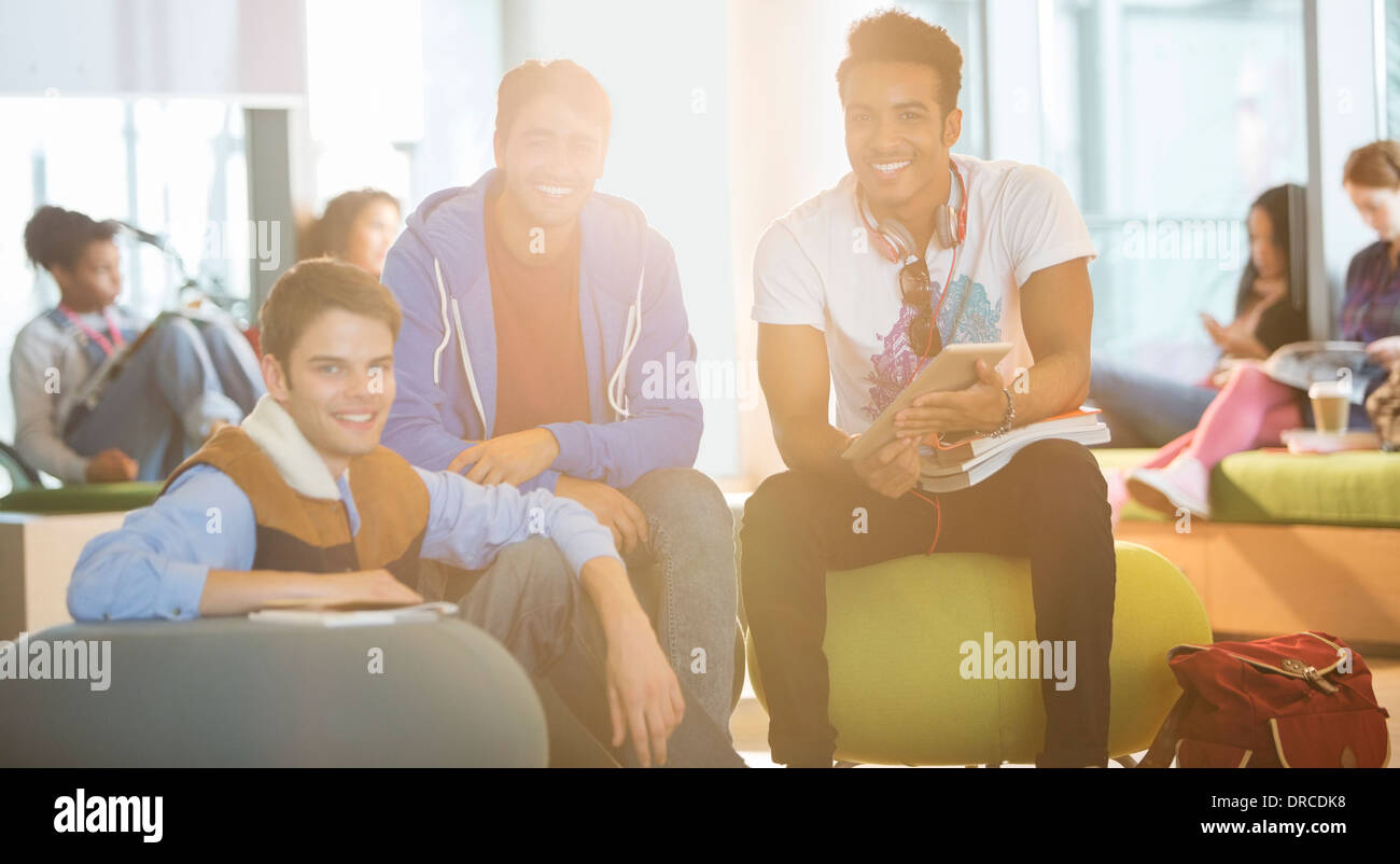University students smiling in lounge Stock Photo