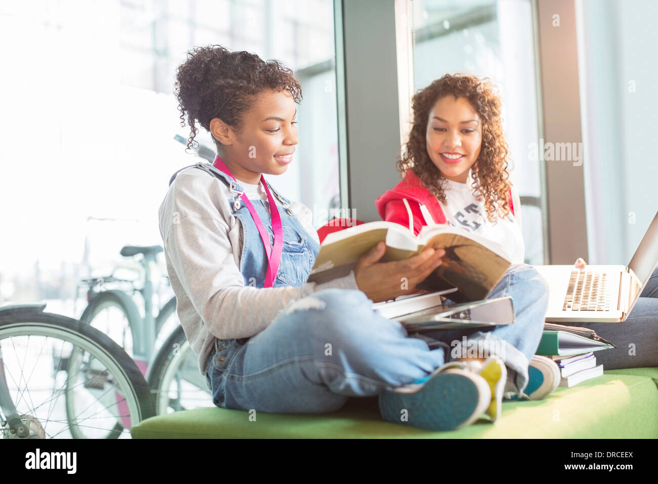 University students working together on bench Stock Photo