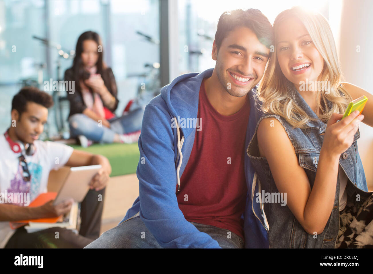 University students smiling in lounge Stock Photo