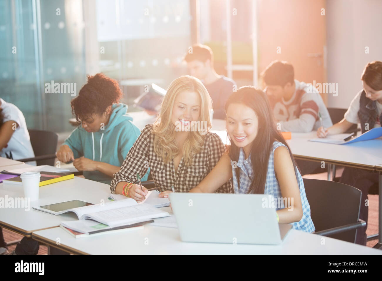 University students working in classroom Stock Photo