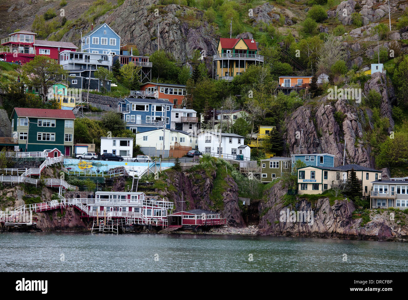 Houses on craggy waterfront Stock Photo