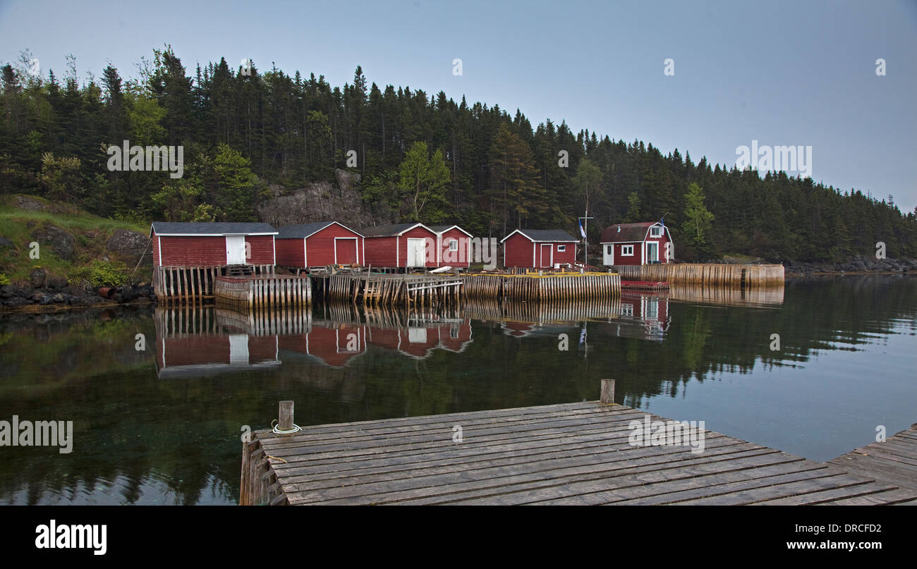 Buildings and docks along calm bay Stock Photo