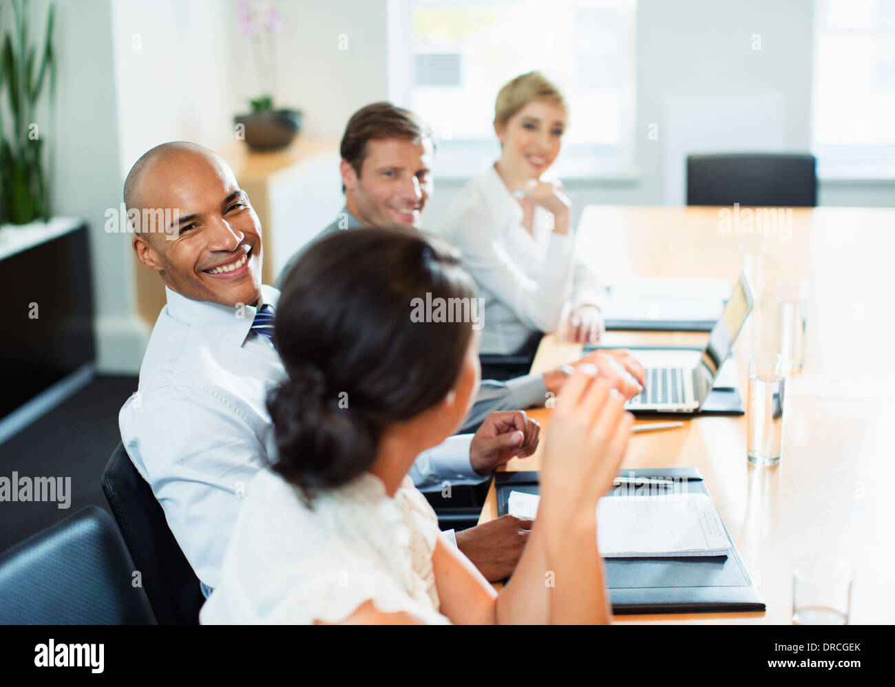 Business people sitting in meeting Stock Photo - Alamy