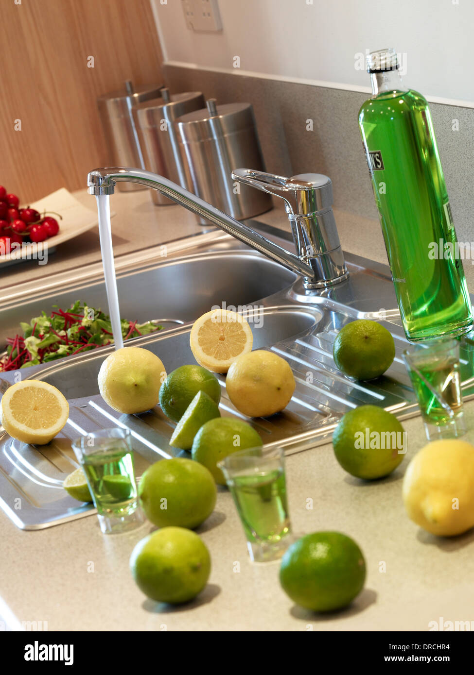 Food preparation at the kitchen sink. Stock Photo