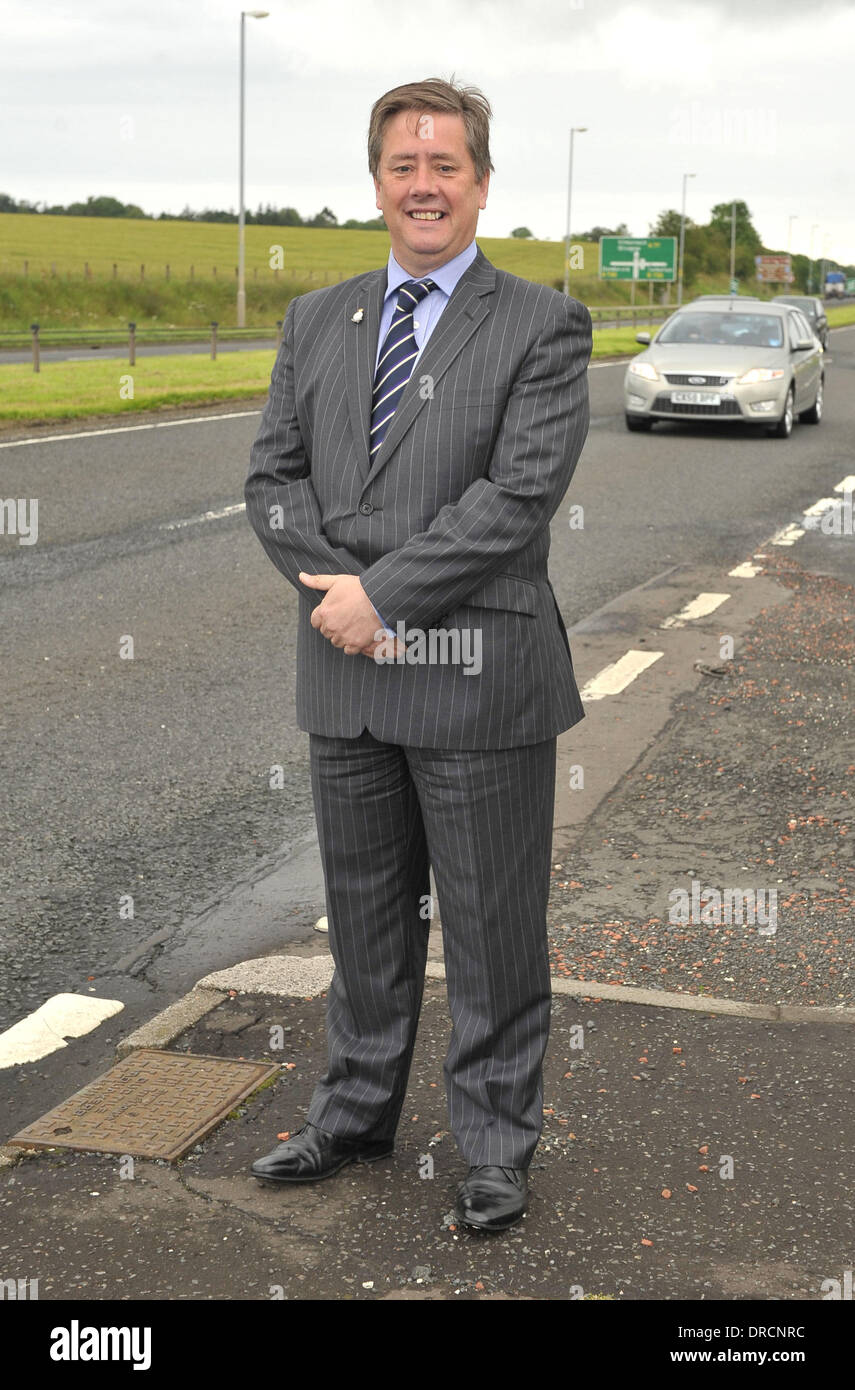 Transport Minister Keith Brown vists the site of the A77 in the south of Scotland where 20 million pound road improvement works are soon to start. Brown said that significant improvements would be brought to users of the road as he announced details of the bidders to tender on the A77 Symington to Bogend Toll scheme, as well as the A75 Dunragit Bypass. The four companies selected t Stock Photo