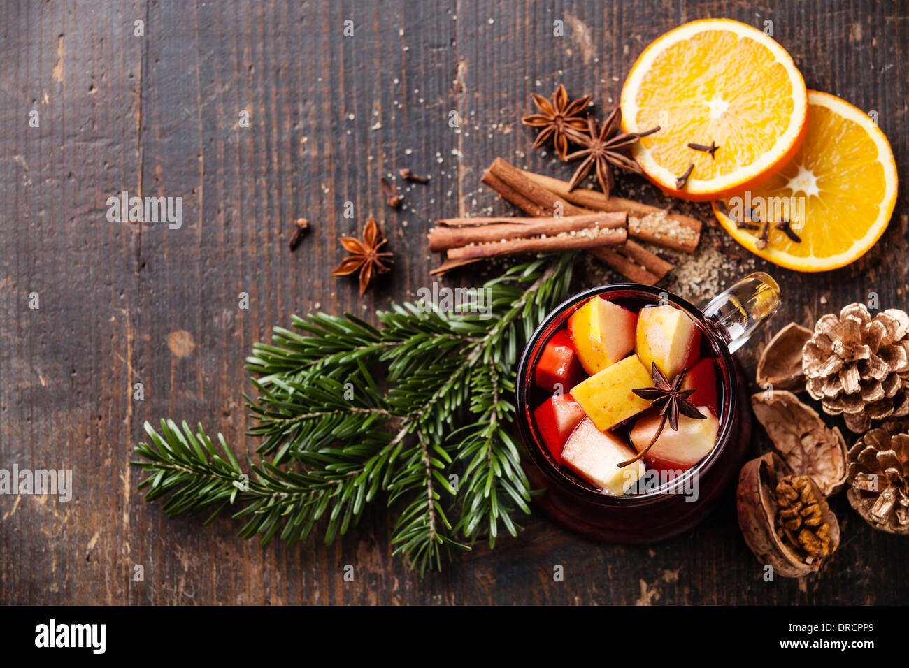 Cup of hot wine with spices on wooden background Stock Photo