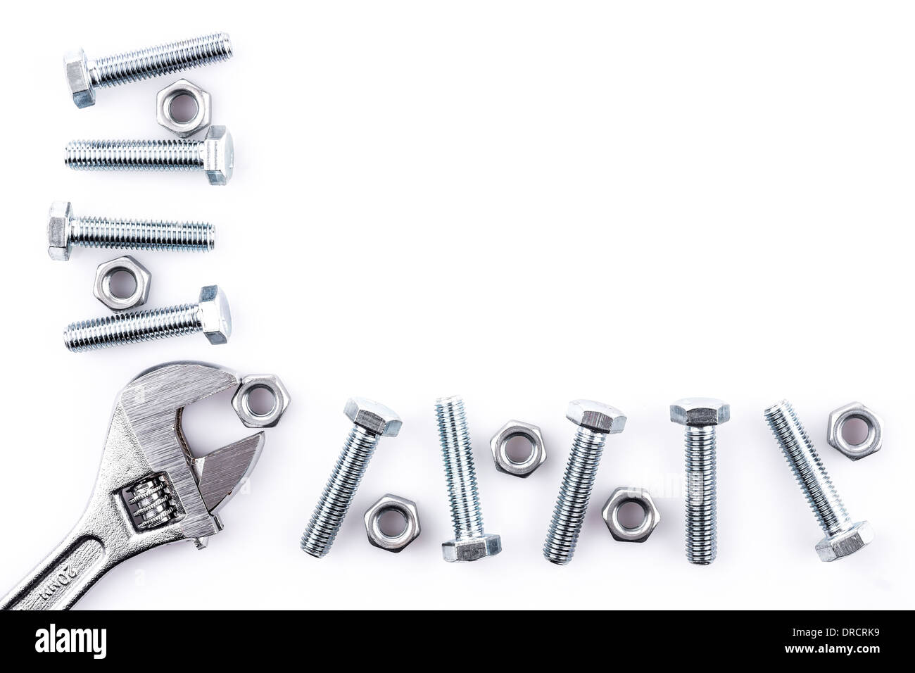 Screws, nuts and spanner isolated on white background Stock Photo