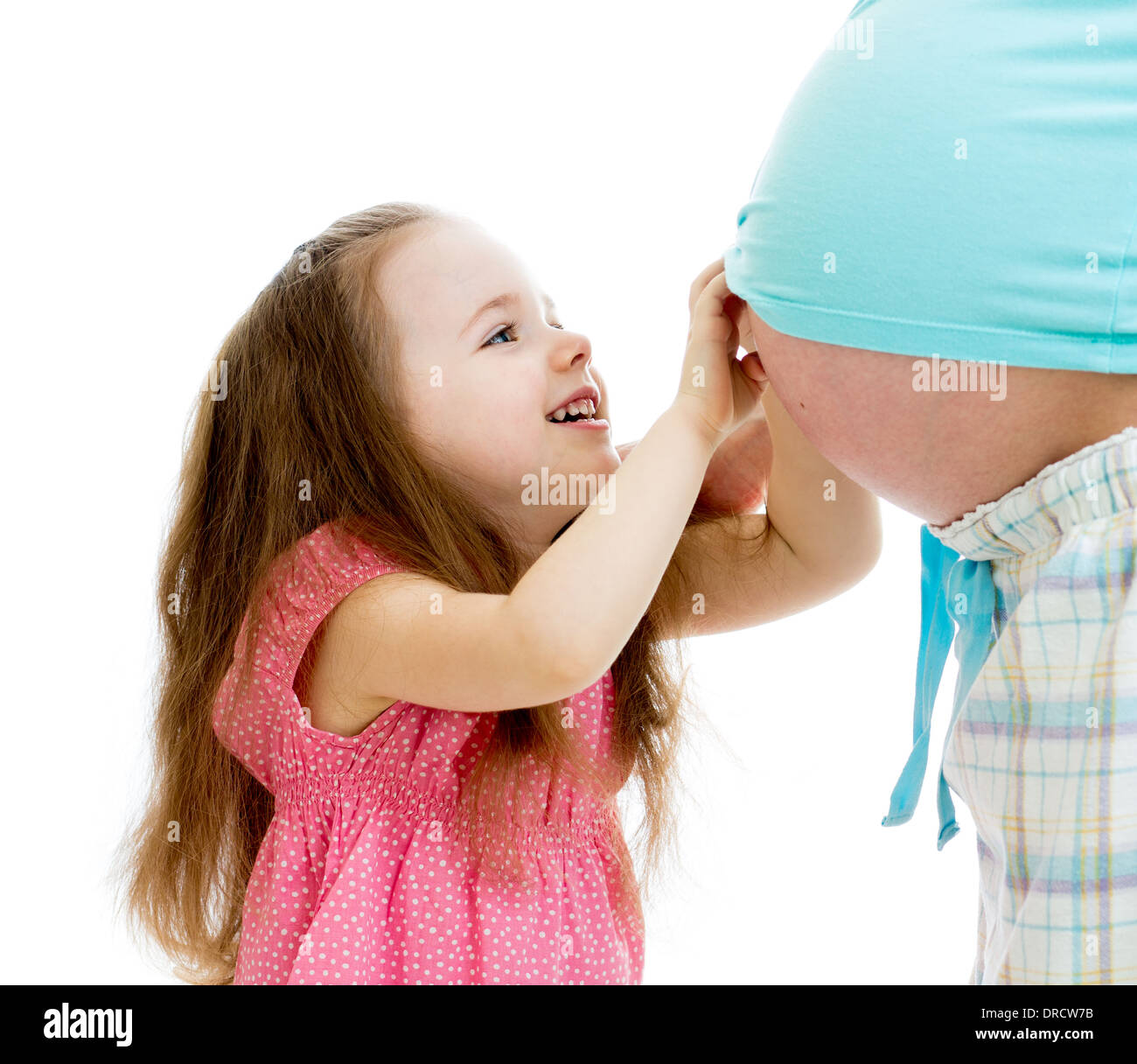 kid girl touches pregnant mother's belly isolated Stock Photo - Alamy