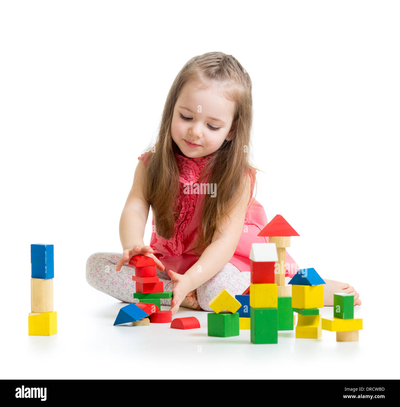 child girl playing with colorful building block toys Stock Photo