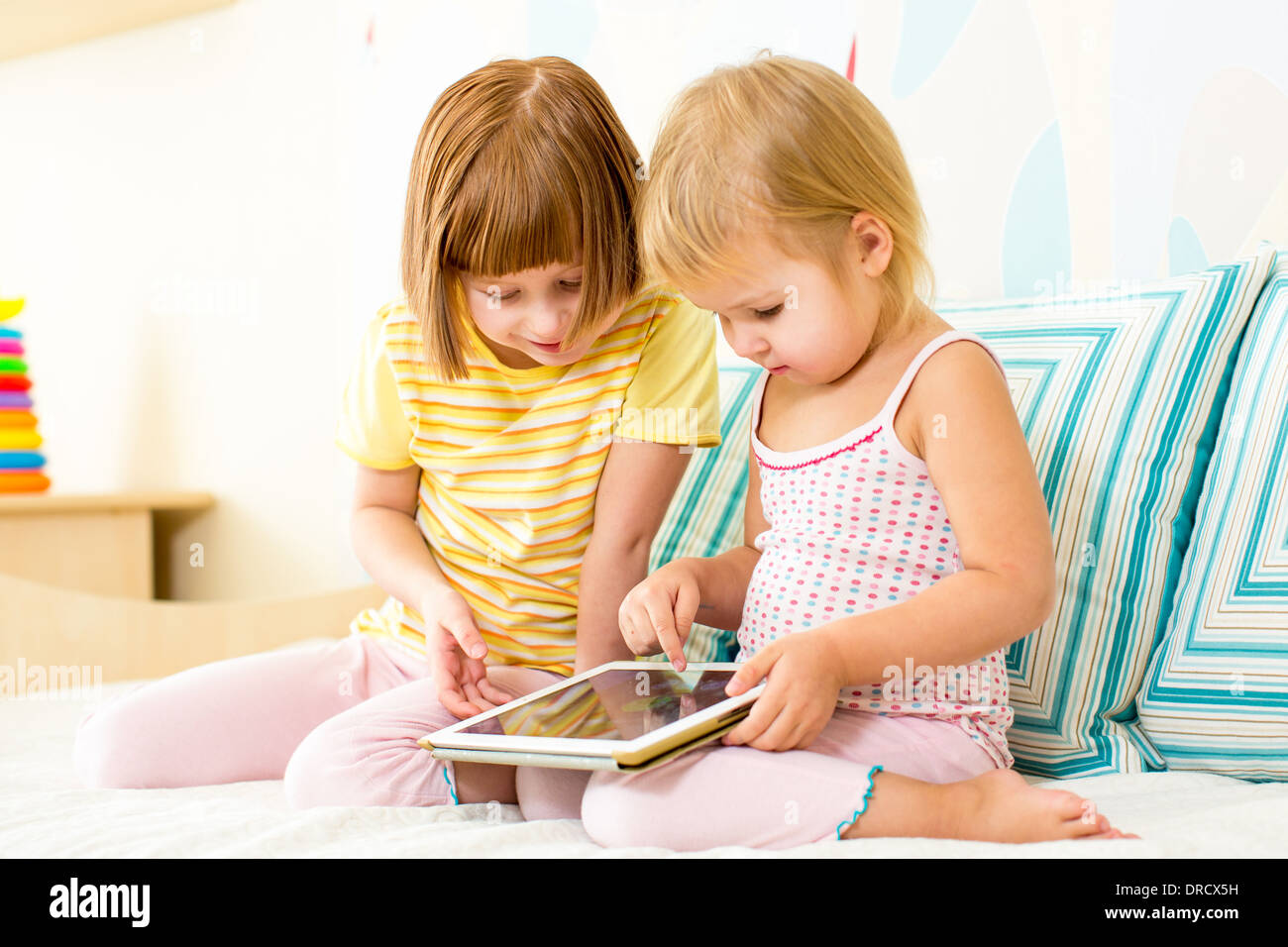 kids playing with digital tablet Stock Photo