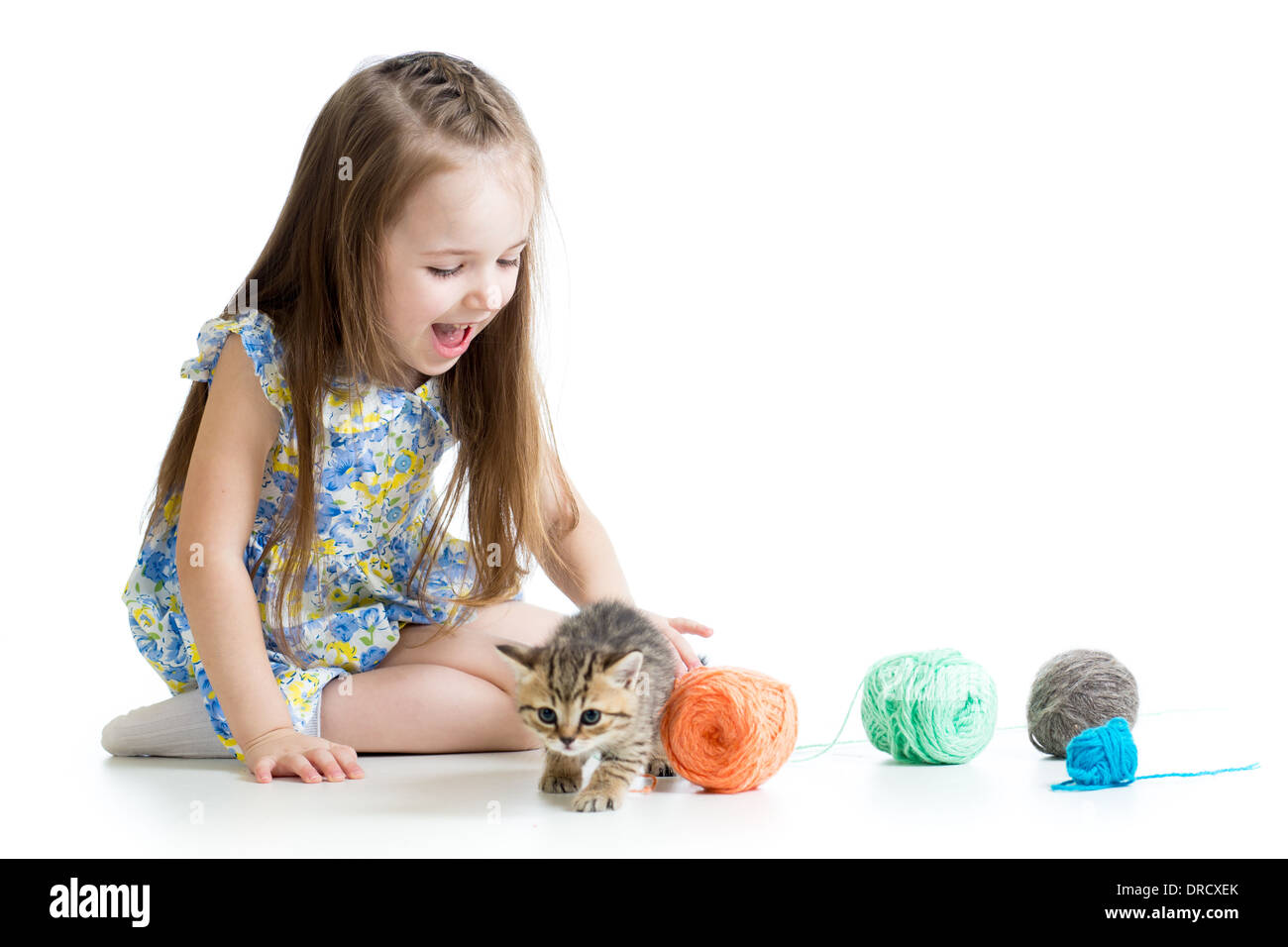 child girl playing with kitten isolated on white background Stock Photo