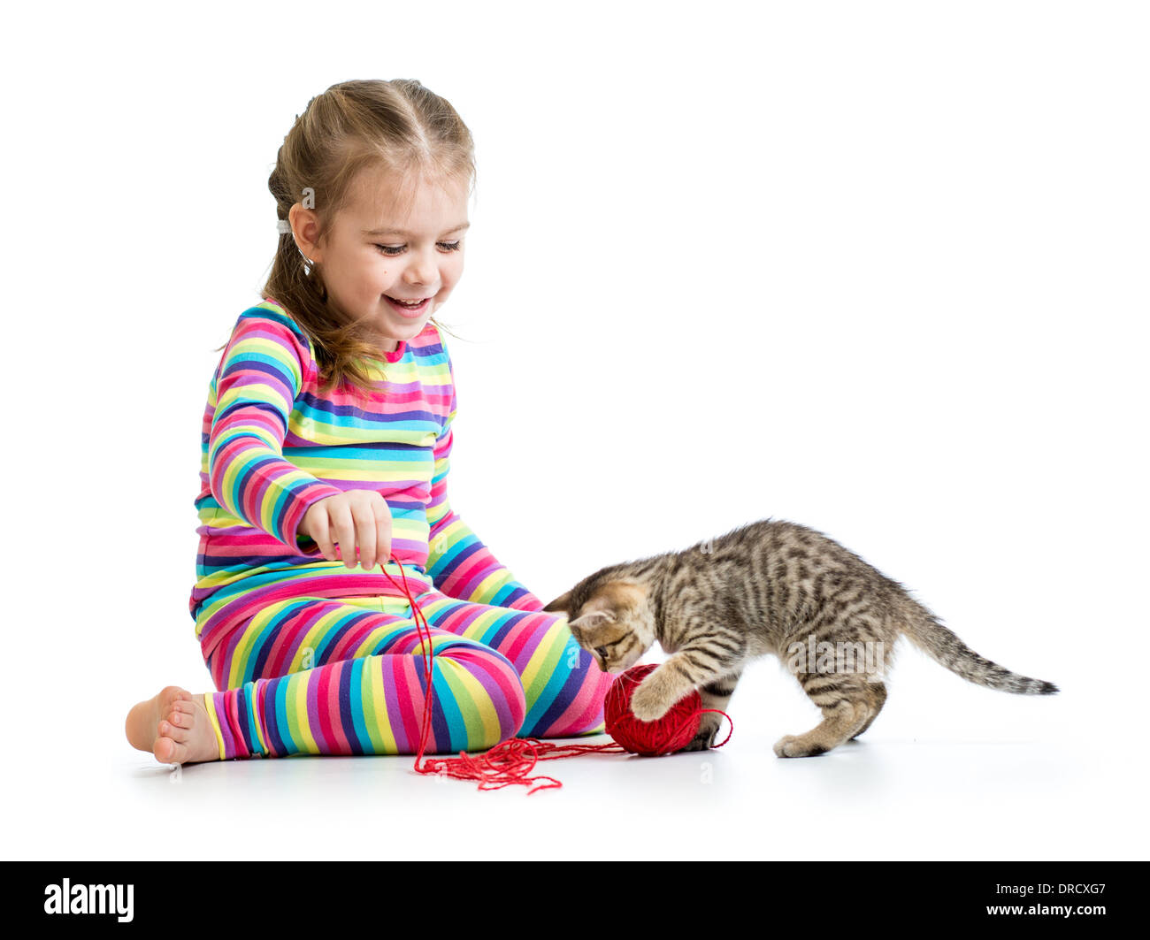smiling kid playing with kitten Stock Photo