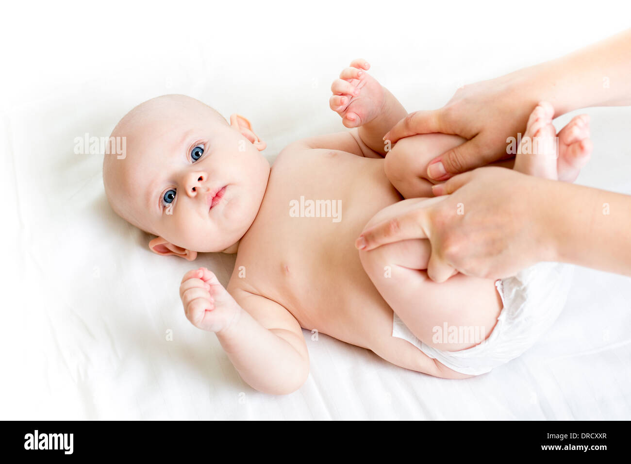 mother doing gymnastics her baby infant Stock Photo