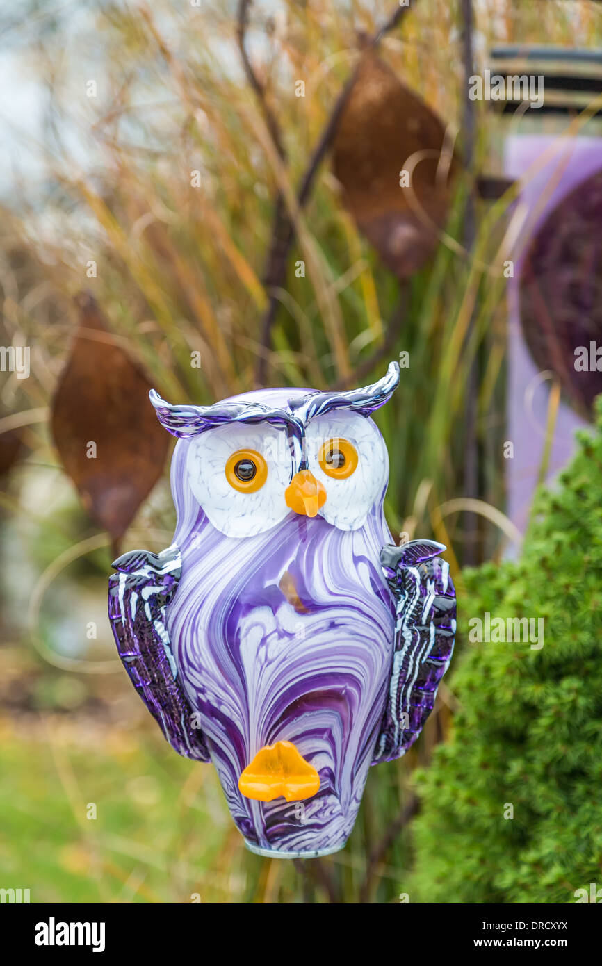 Owl made of colored glass in the garden Stock Photo