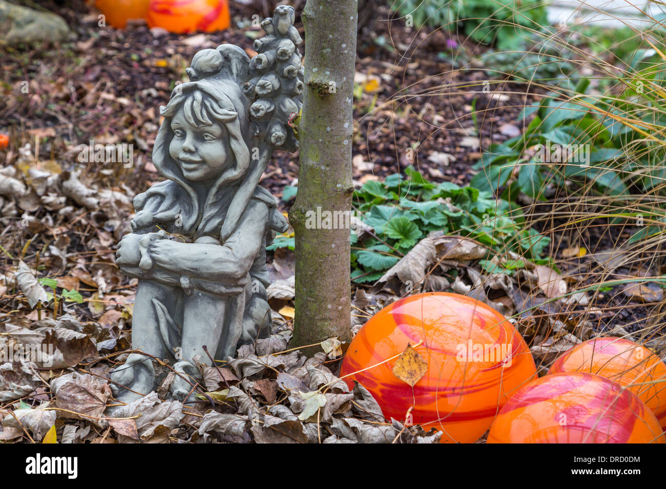 funny elves in the colorful autumn garden Stock Photo