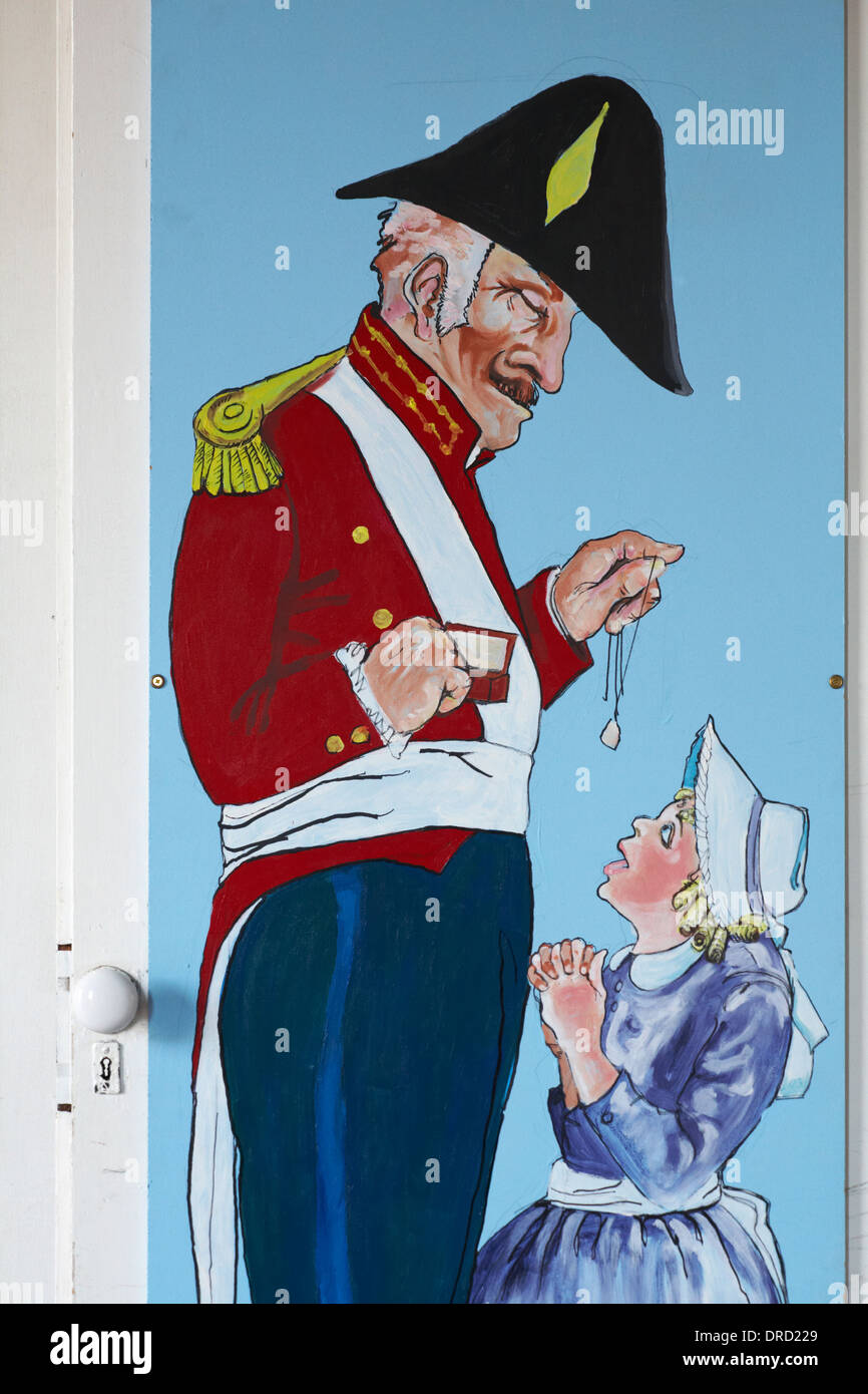 painting of Royal Marine Officer and young girl on outside of store at Portsmouth Historic Dockyard Stock Photo
