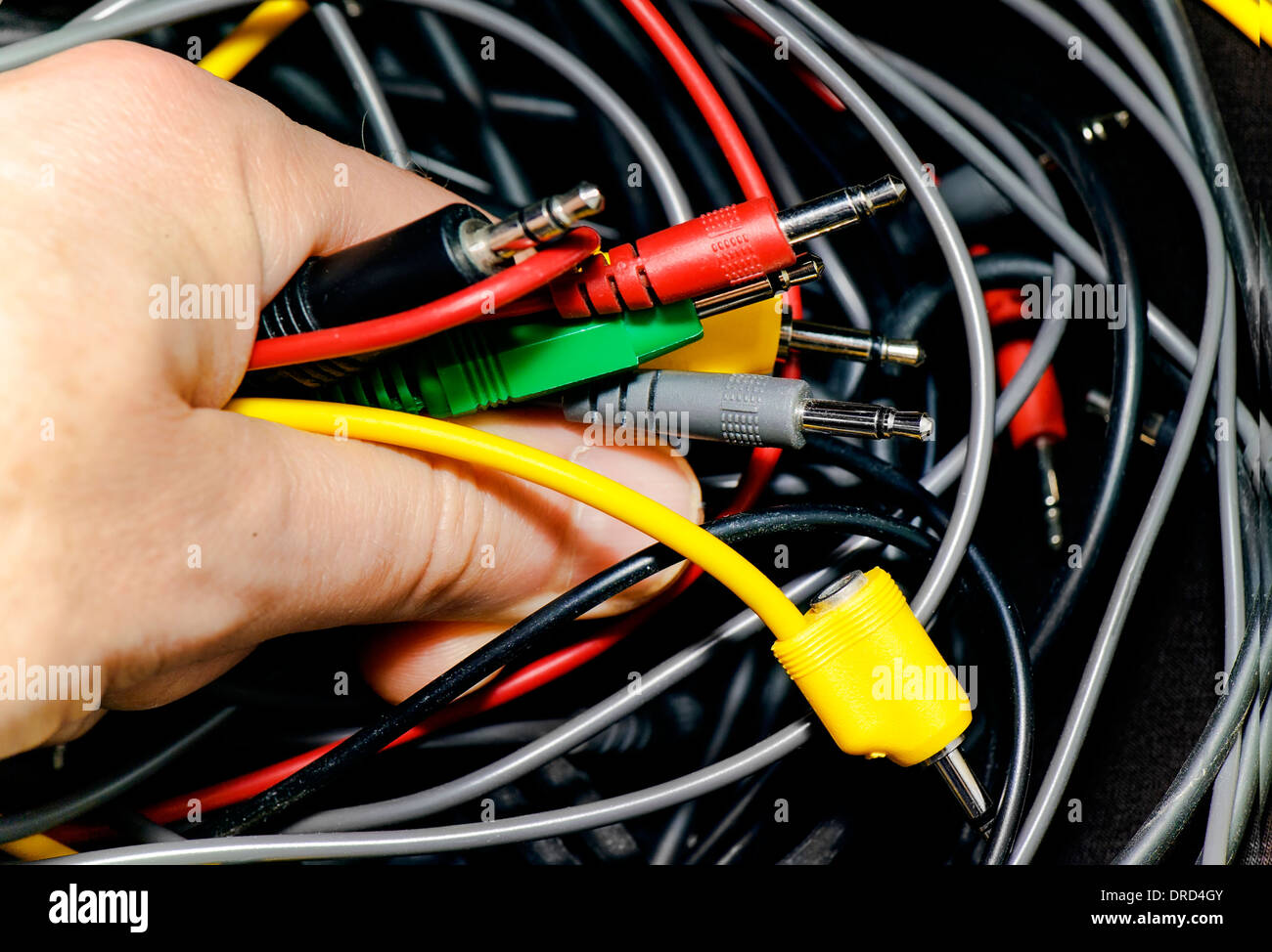 hand holding wires Stock Photo