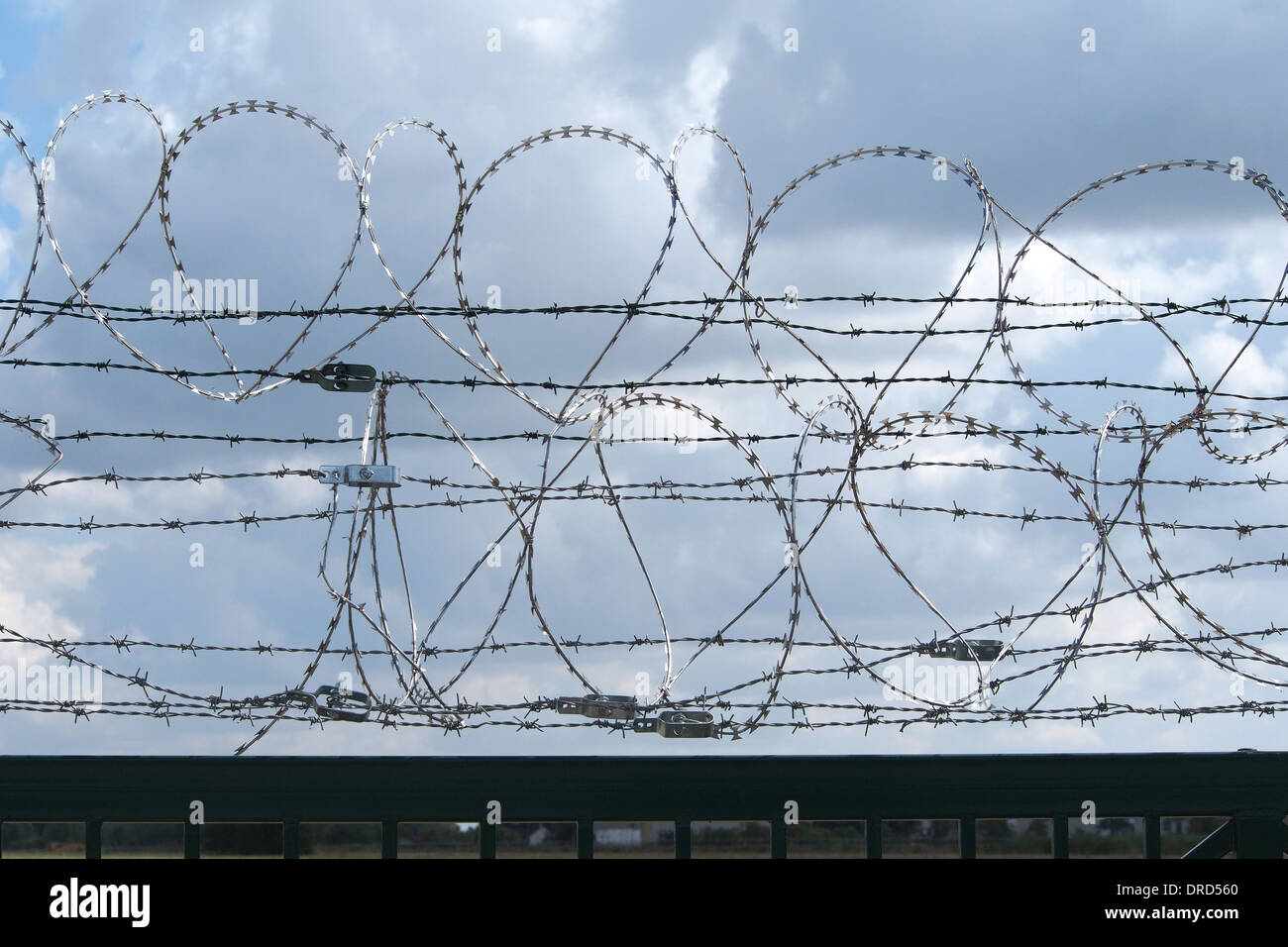 Restricted area - fence with barbed wire Stock Photo - Alamy