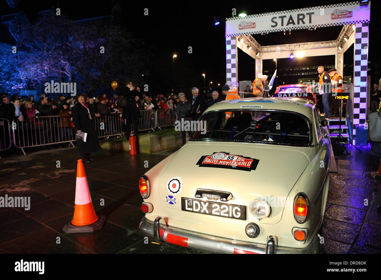 Paisley, Scotland, UK. 23rd January 2014. The Volvo 122S driven by Gordon Glen is next in line and waiting for The Datsun 240Z to leave the starting point at the UK leg of the Rallye Monte-Carlo Historique in Paisley. Credit:  PictureScotland/Alamy Live News Stock Photo