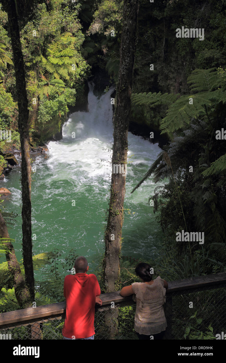 Couple looking at Okere Falls Scenic Reserve, Kaituna River, near Rotaroa, North Island, New Zealand Stock Photo