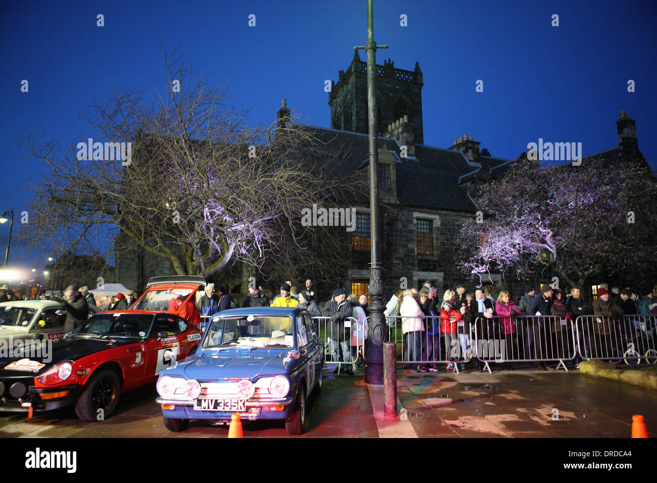 Paisley, Scotland, UK. 23rd January 2014. Final preparations of the classic cars before the UK start of the Rallye Monte-Carlo Historique in front of Paisley Abbey Credit: © PictureScotland/Alamy Live News  Stock Photo