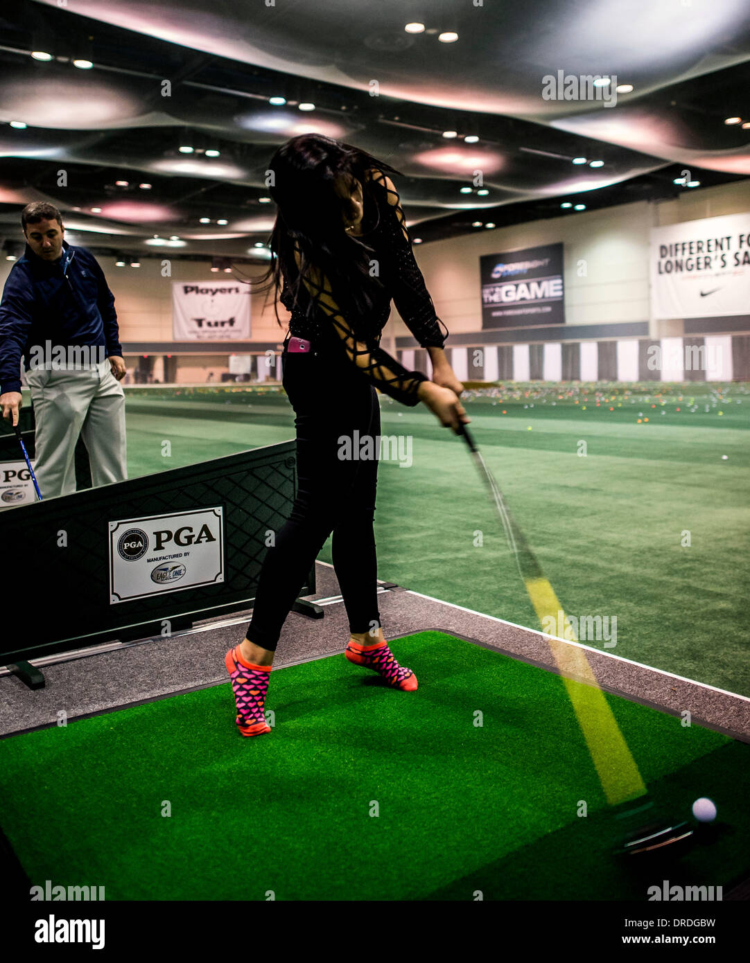 Orlando, Florida, USA. 22nd Jan, 2014. TORI JONES of Ashland, Ohio, tries out a new driver during the PGA Merchandise Show at the Orange County Convention Center. With over one million square feet of exhibit space and 41,000 attendees from all 50 U.S. states and 74 countries, the show serves as a global platform for PGA professionals, industry leaders, manufacturers and golf organizations to grow the business, participation and interest in golf. Credit:  Brian Cahn/ZUMAPRESS.com/Alamy Live News Stock Photo