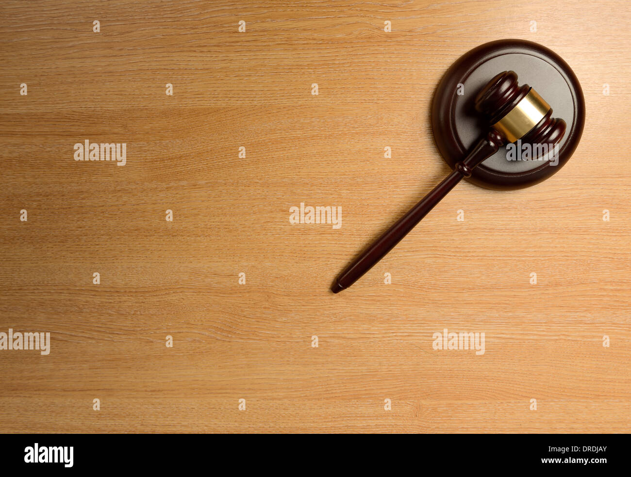 A gavel isolated on a wood table Stock Photo