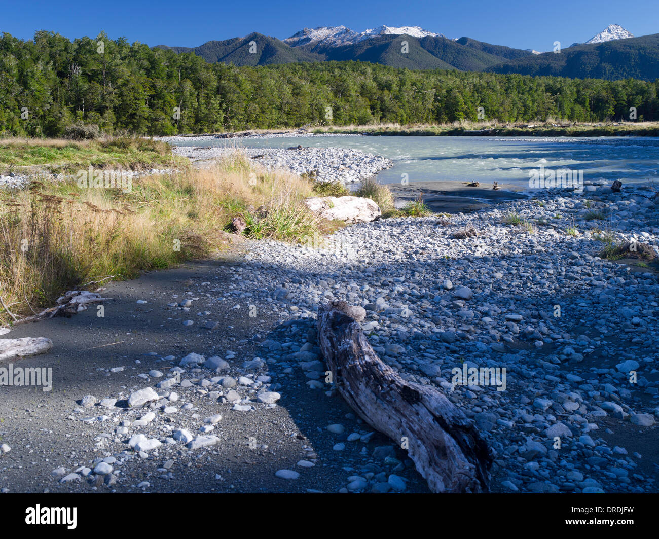 Low-angle view of the Mariua River and cobbles, with the Victoria Range in the background; Canterbury, New Zealand; June 2013 Stock Photo