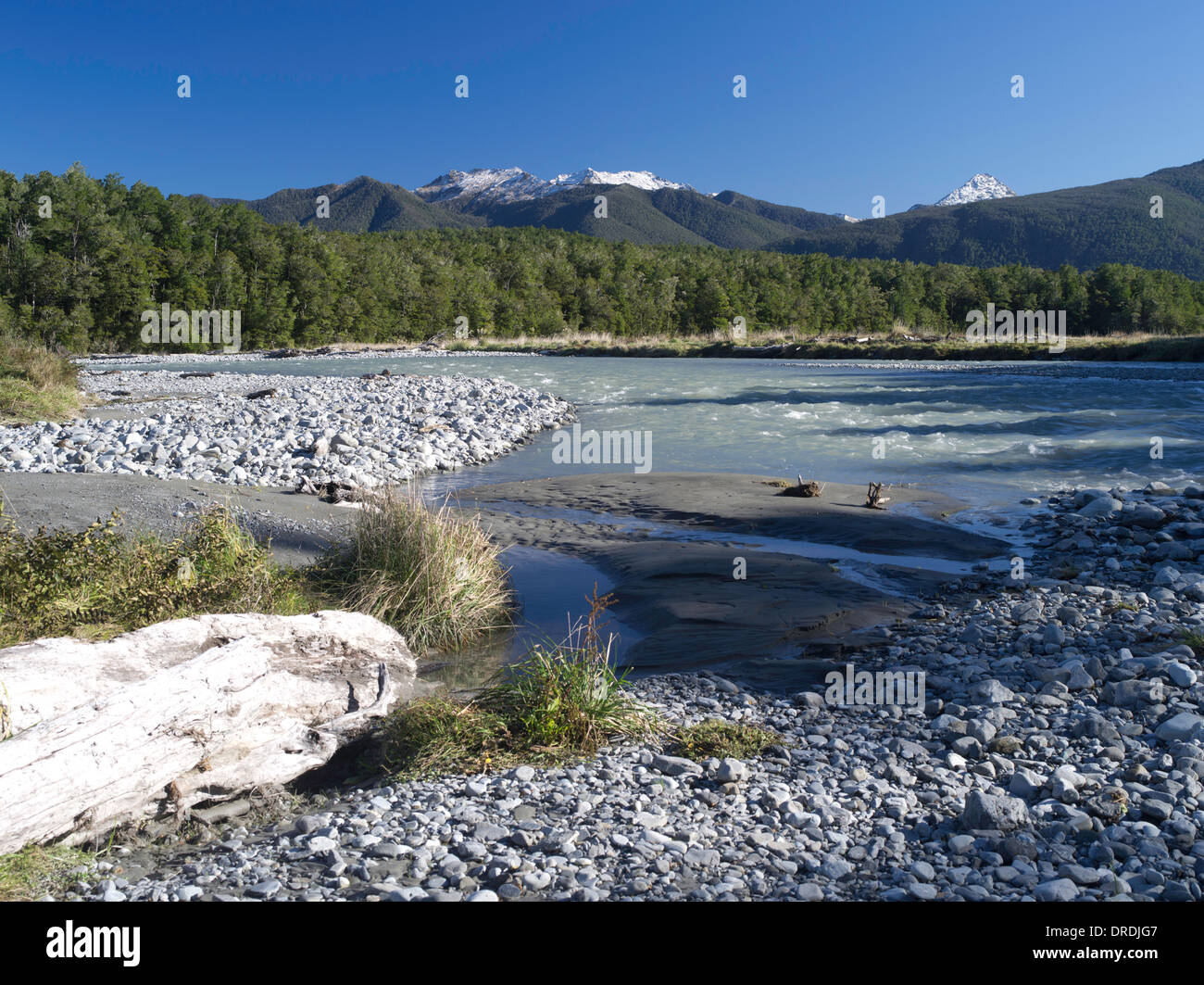 Low-angle view of the Maruia River and cobbles, with the Victoria Range in the background; Canterbury, New Zealand; June 2013 Stock Photo
