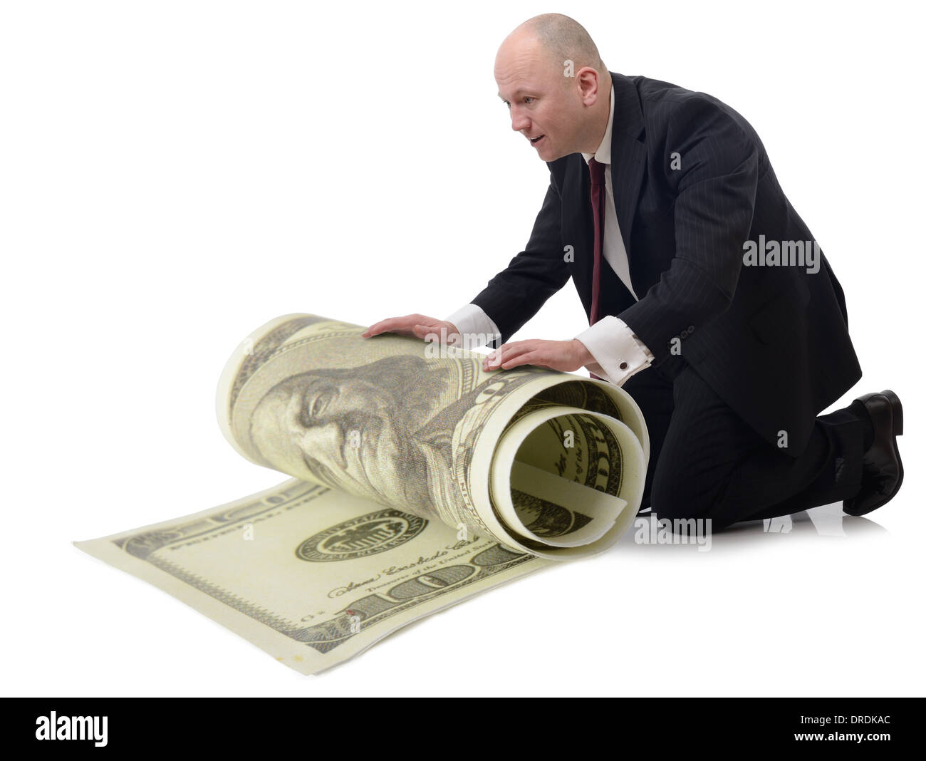 Rolling Paper Cut Out Stock Images Pictures Alamy - taking care of money a man rolling up a large 100 dollar bill isolated on a