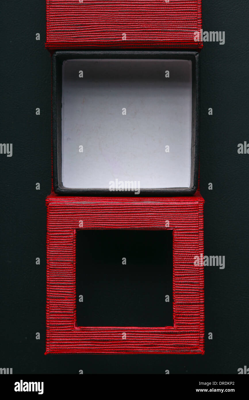 Red black rectangular ring jewellery box on dark background Stock Photo