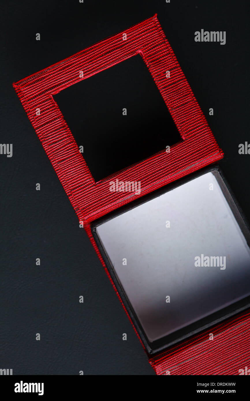 Red black rectangular ring jewellery box on dark background Stock Photo