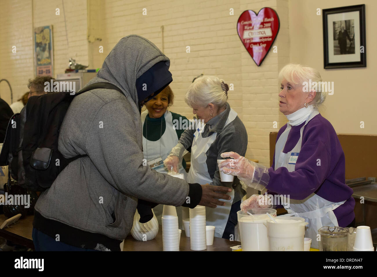 Detroit, Michigan Volunteers serve a meal to the homeless and low