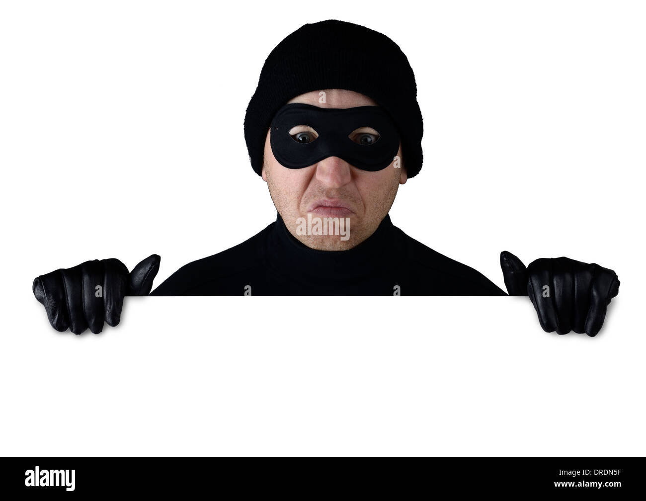 Thief peering over the top of isolated white copy space Stock Photo